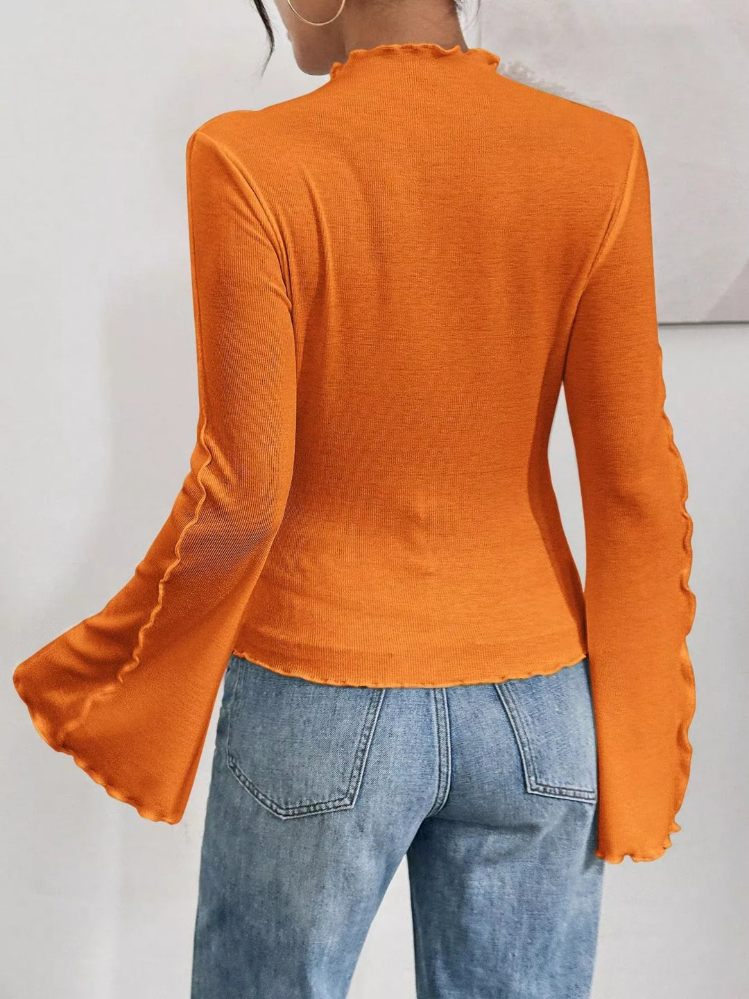 Ribbed knit mock neck top with lettuce-edge flare sleeves