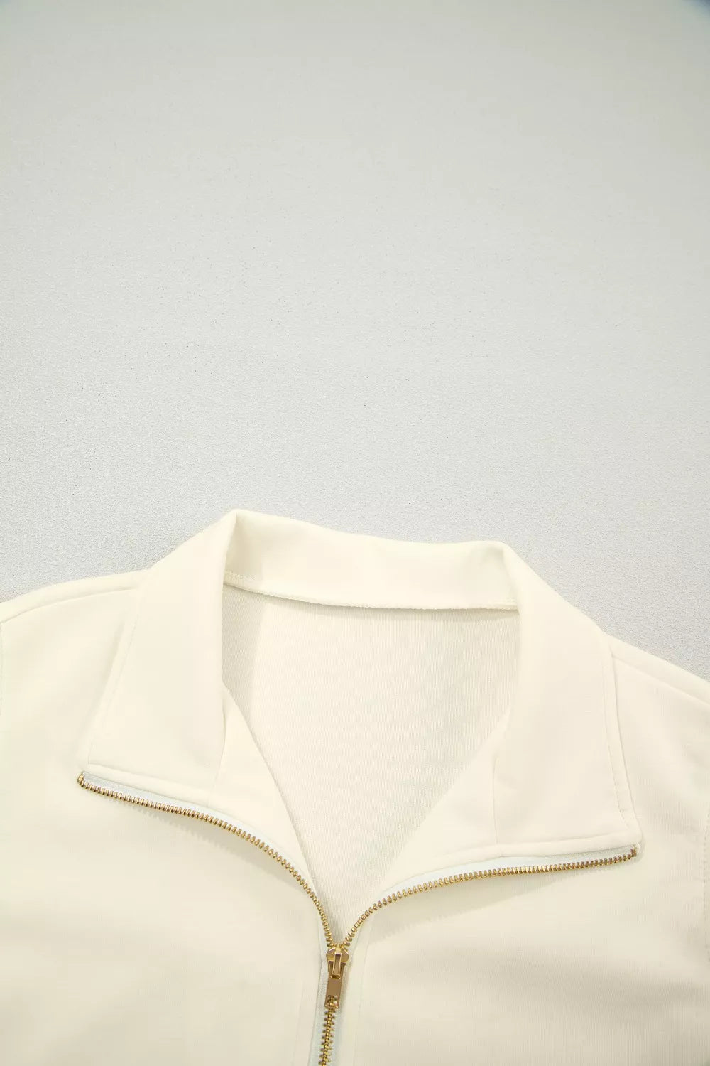 Ruffle cap sleeve half-zip stand collar blouse