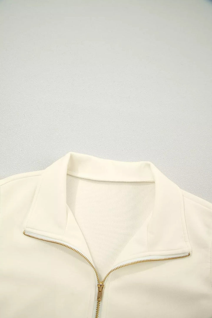 Ruffle cap sleeve half-zip stand collar blouse