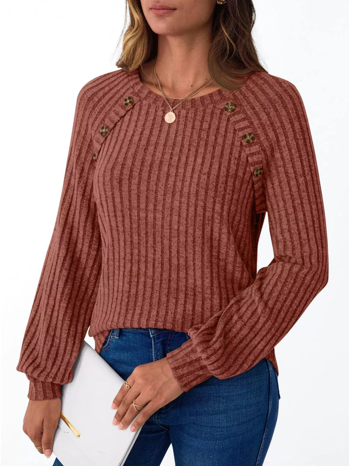 Ribbed knit long sleeve top with decorative shoulder buttons