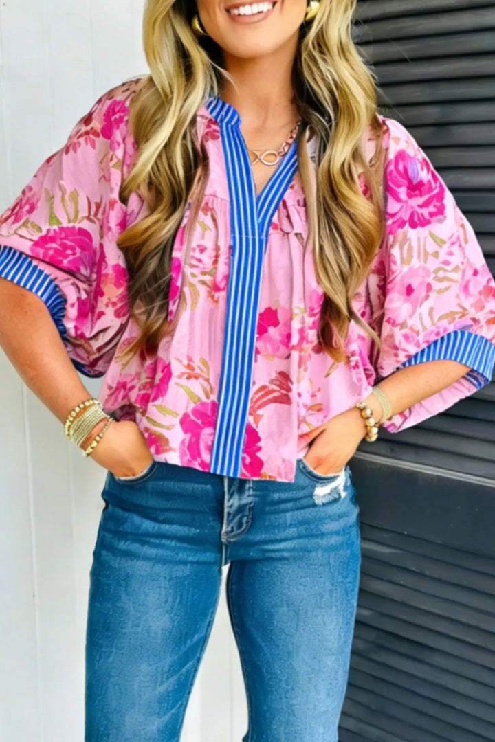 Fuchsia Pink Floral relaxed blouse with striped V-neck and cuff trim