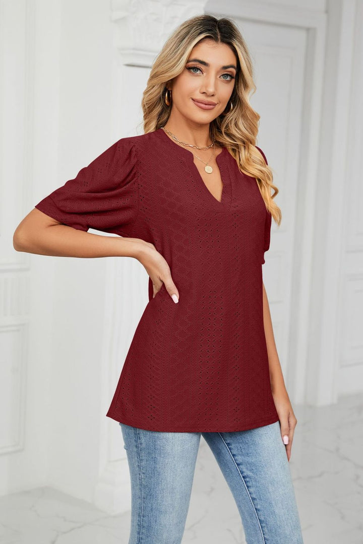 Eyelet puff sleeve top with notched V-neck