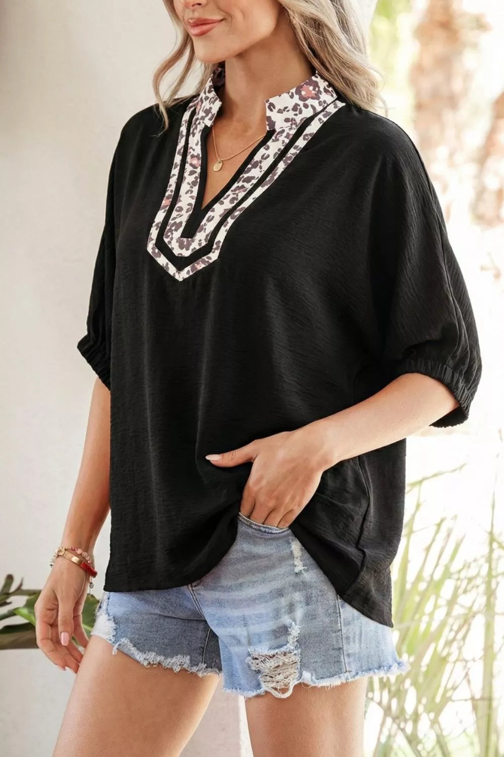Plus size notched V-neck top with leopard collar trim