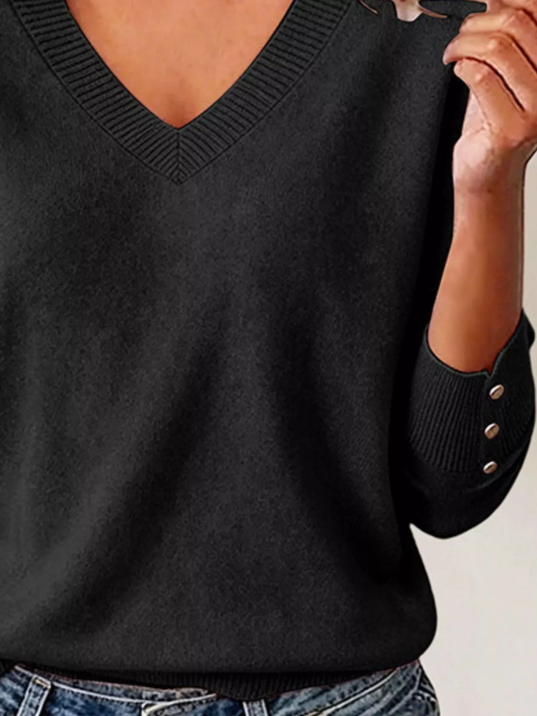 V-neck long sleeve sweater with button cuffs and side slits