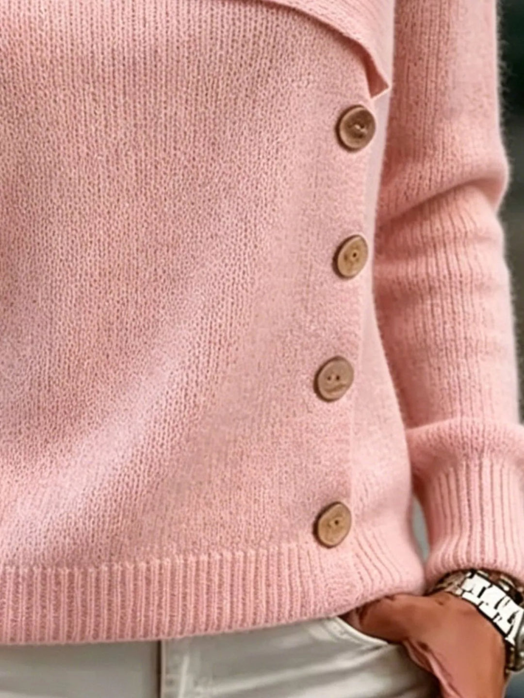 Asymmetrical button sweater with angled ribbed neckline