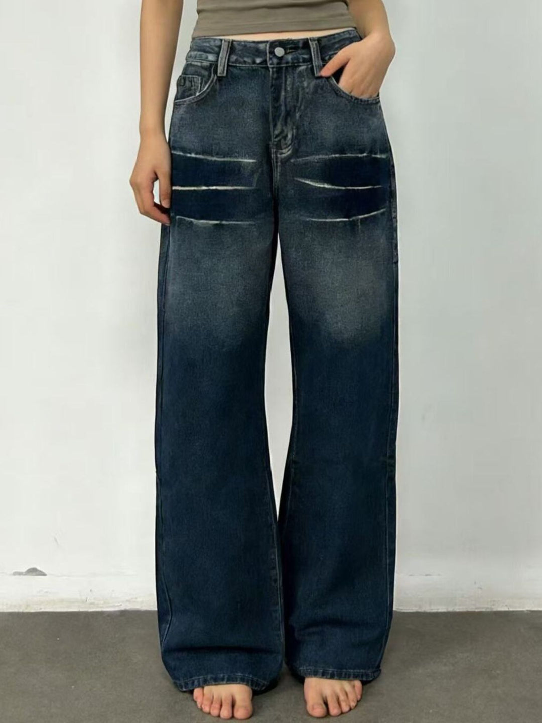 Distressed wide-leg jeans with faded thigh wash