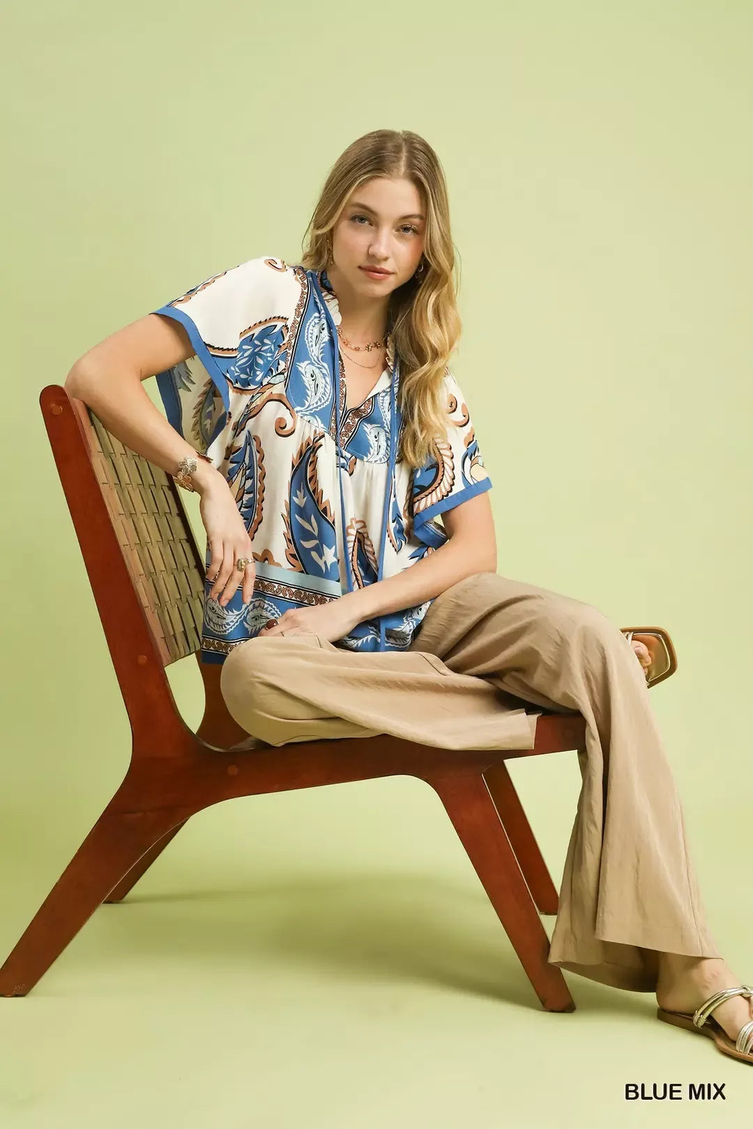 Relaxed paisley border print top with tassel tie neckline