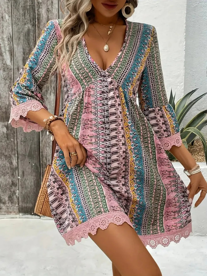 Boho printed mini dress with lace trim and bell sleeves