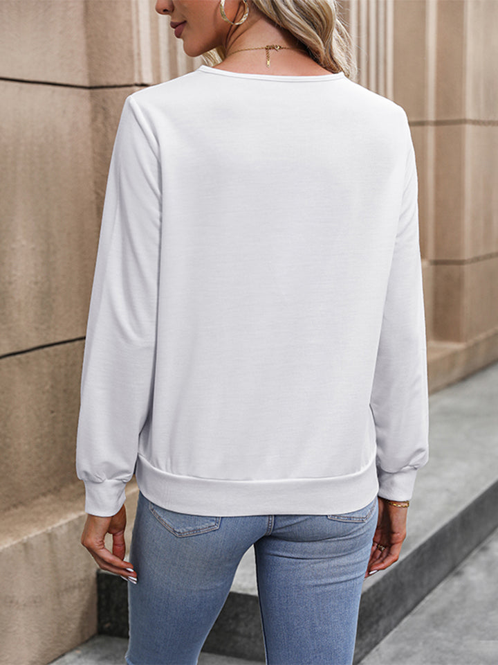 Pleated surplice V-neck long sleeve blouse