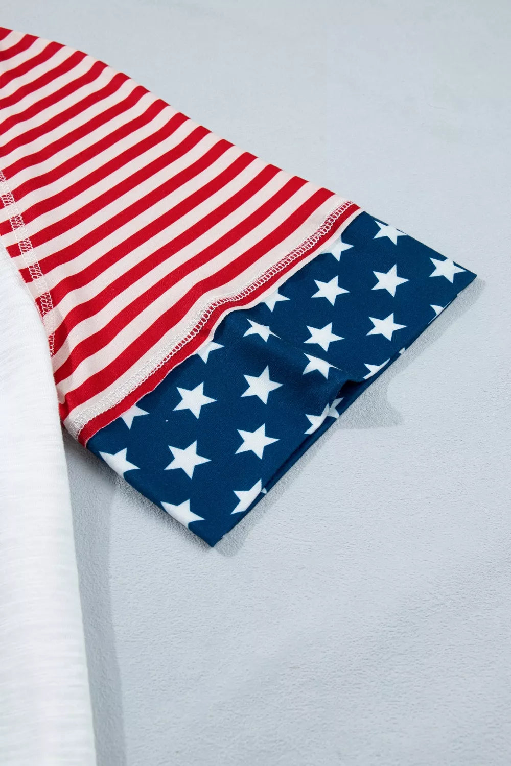 Star patch flag-inspired V-neck top with ruffle sleeves
