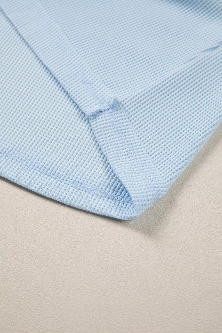 Waffle knit pocket tee with cuffed short sleeves