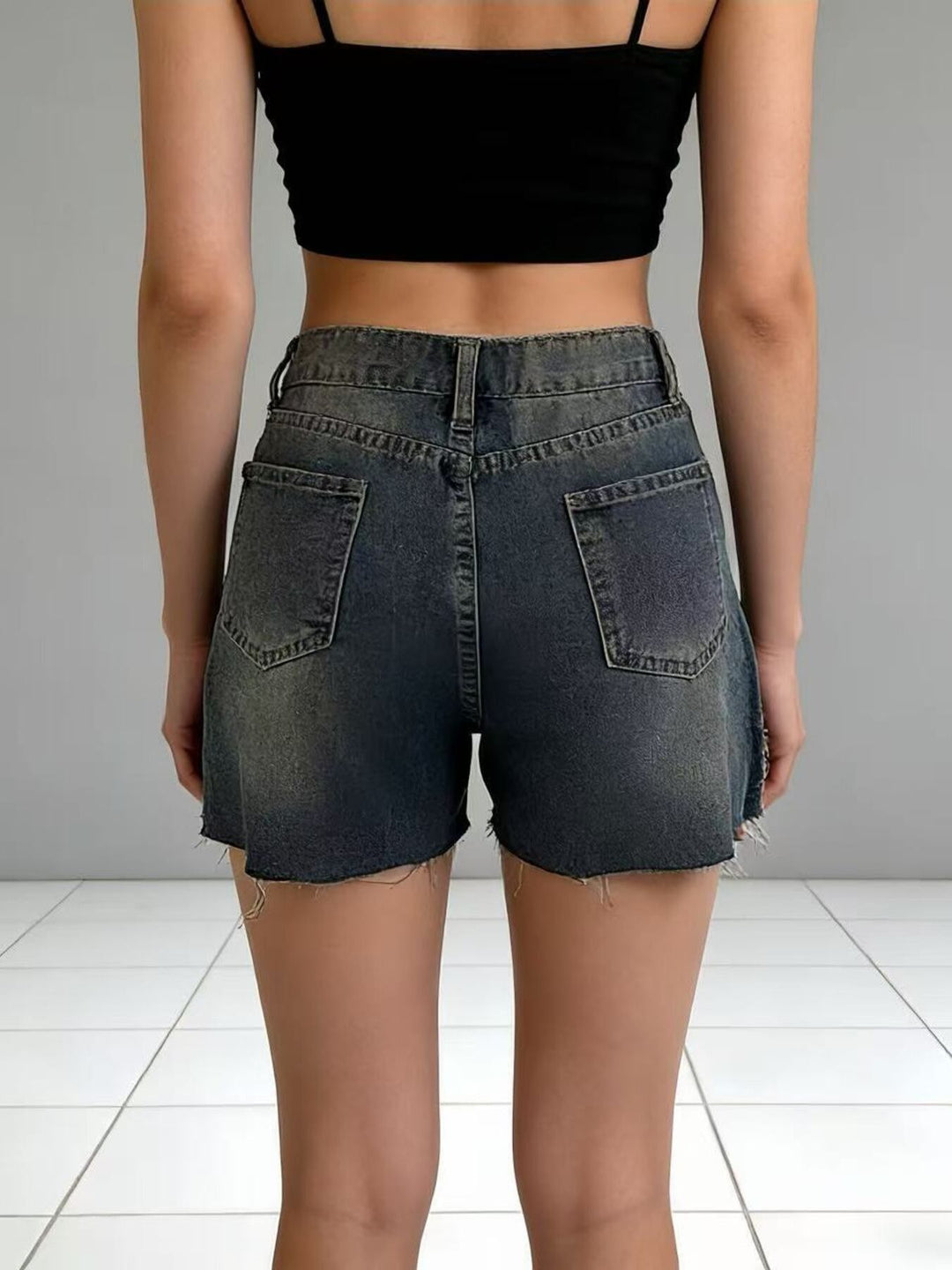 Distressed high-rise denim shorts with frayed raw hem