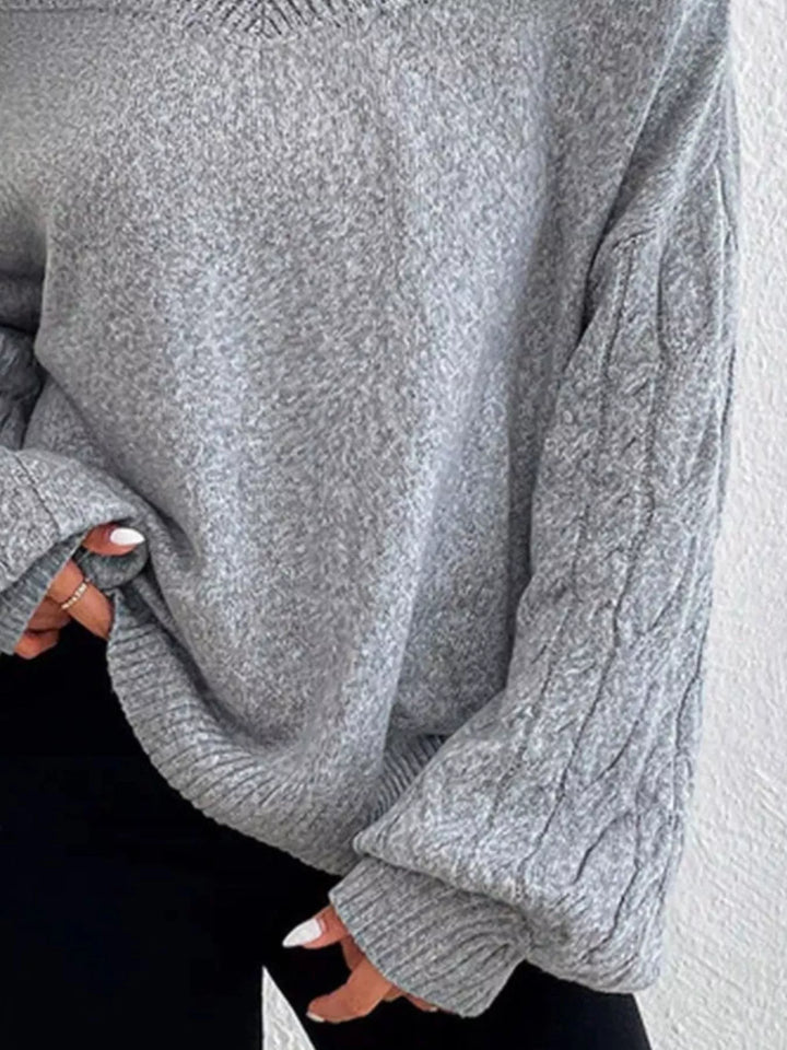 Cold-shoulder cable-knit turtleneck sweater