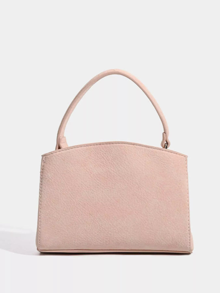 Mini belted crossbody bag with top handle and twist lock