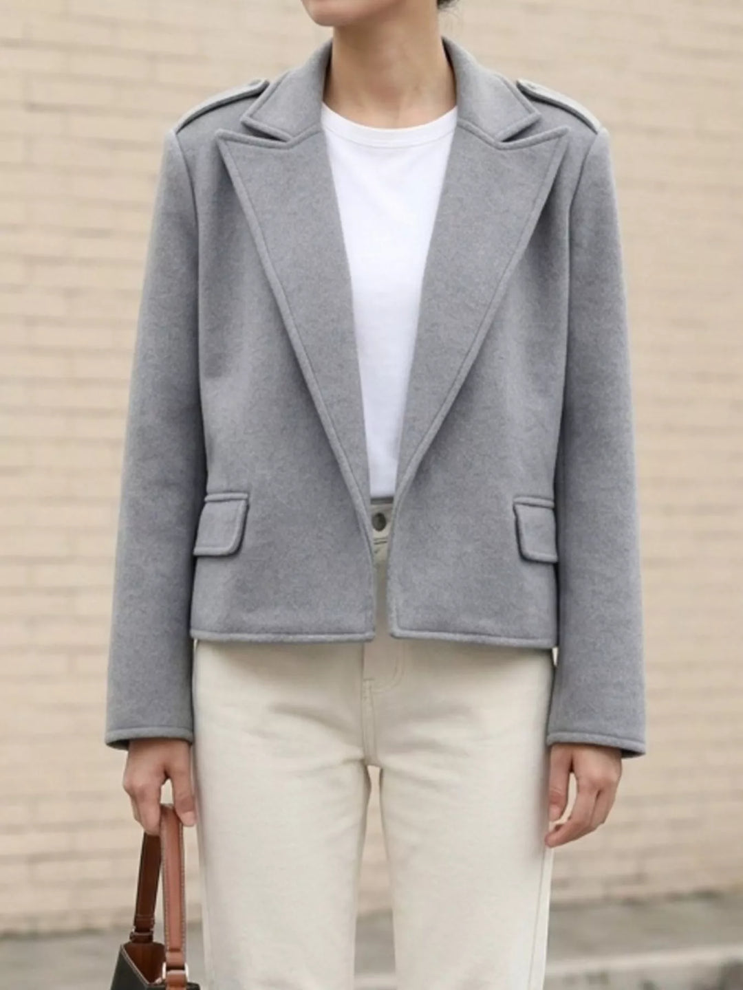 Notch lapel cropped jacket with epaulettes and flap pockets