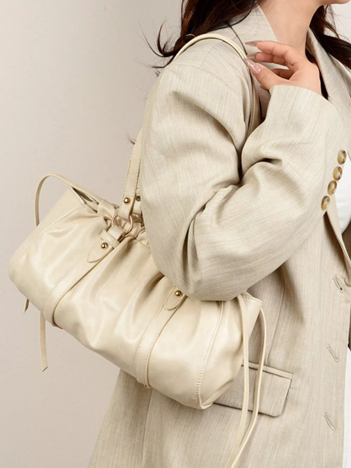 Ruched faux leather shoulder bag with O-ring straps