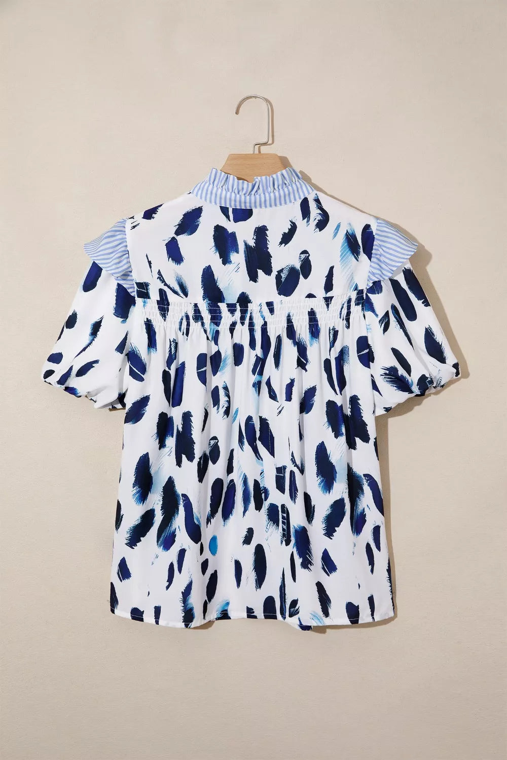 Abstract animal print blouse with striped ruffle yoke