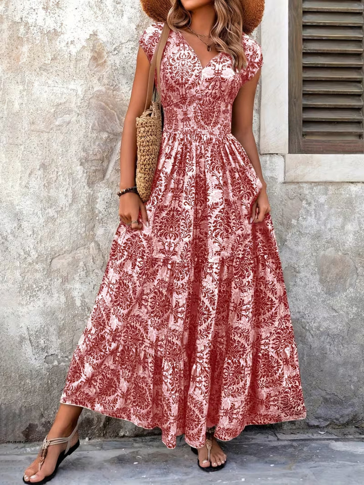 Smocked tiered maxi dress with cap sleeves and side slit