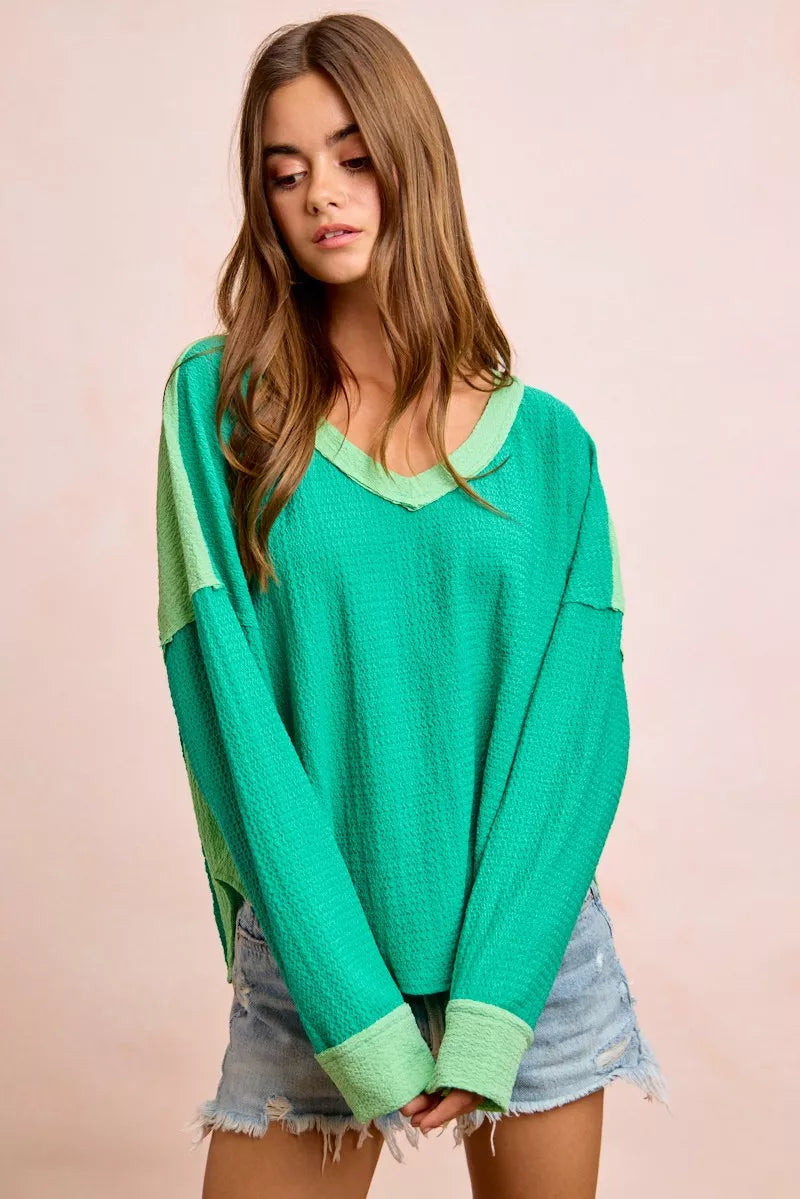Color block long sleeve textured jersey top with raw-cut edges