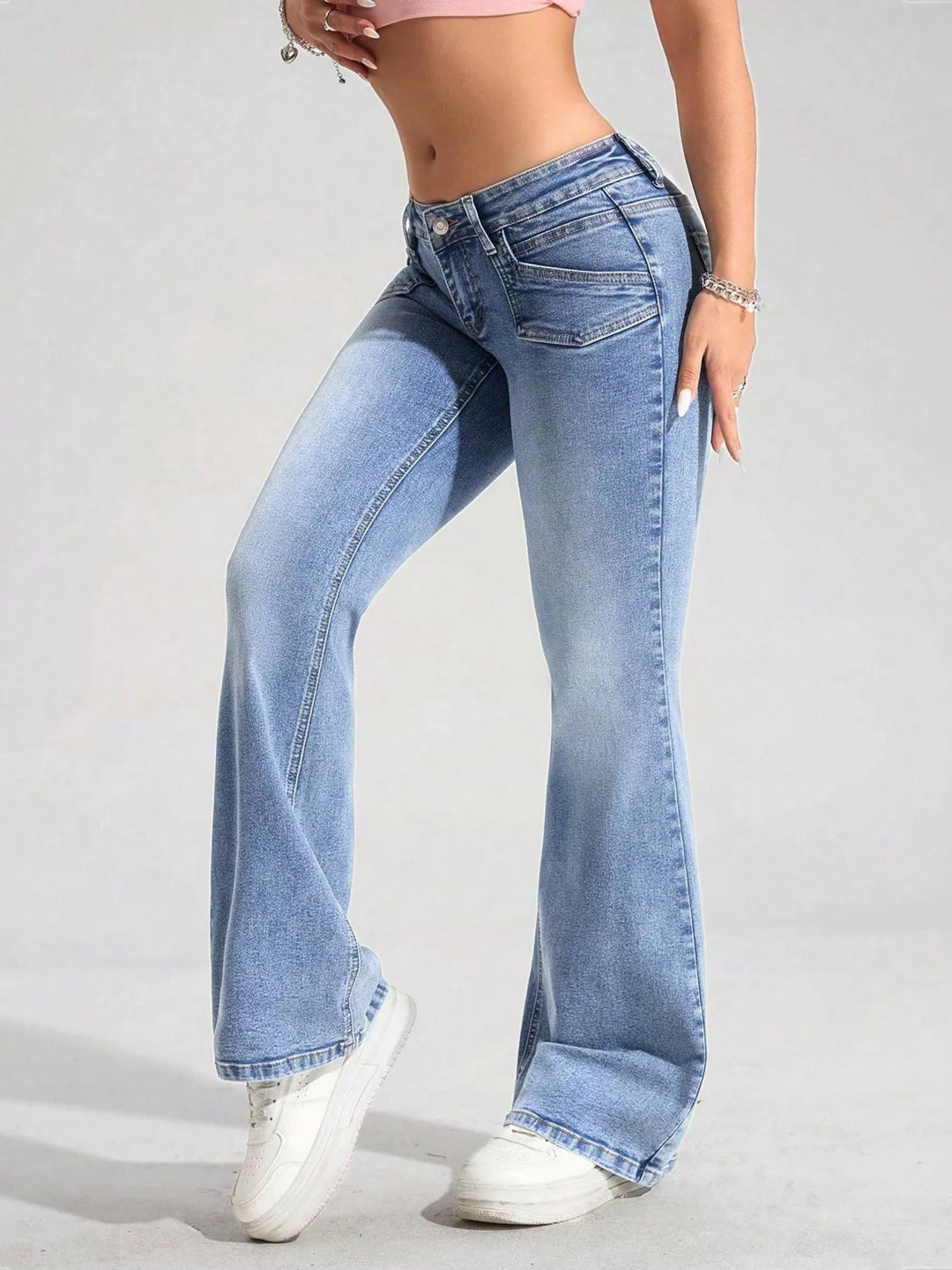 Low-rise flare jeans with flap front pockets and faded wash