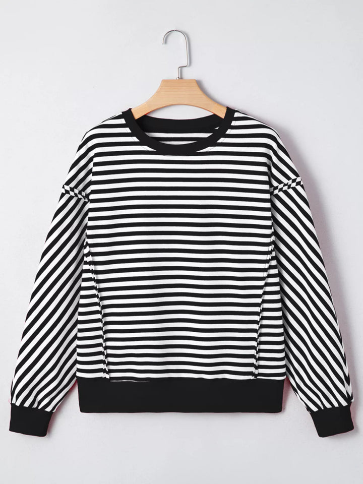 Exposed seam striped drop-shoulder pullover top