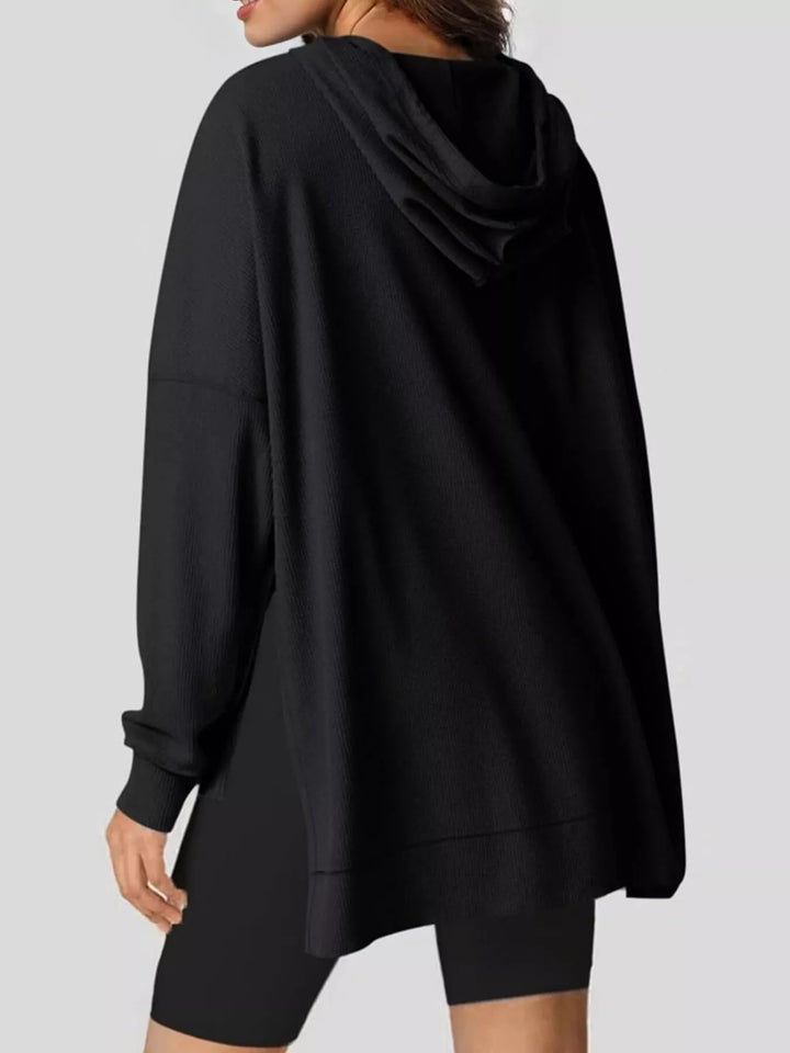 Oversized waffle-knit hoodie with side slits and front pocket