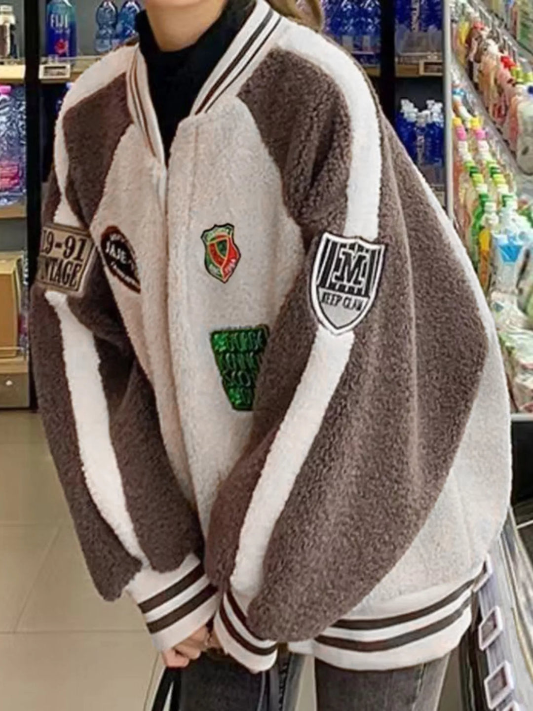 Zip-up sherpa fleece varsity jacket with embroidered patches