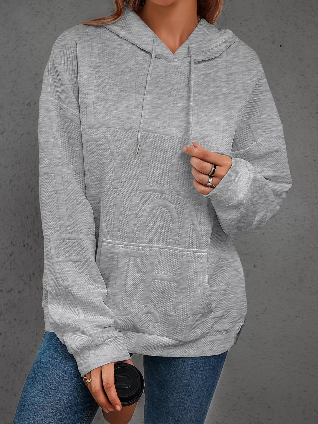 Textured embossed letter pullover hoodie with front pocket
