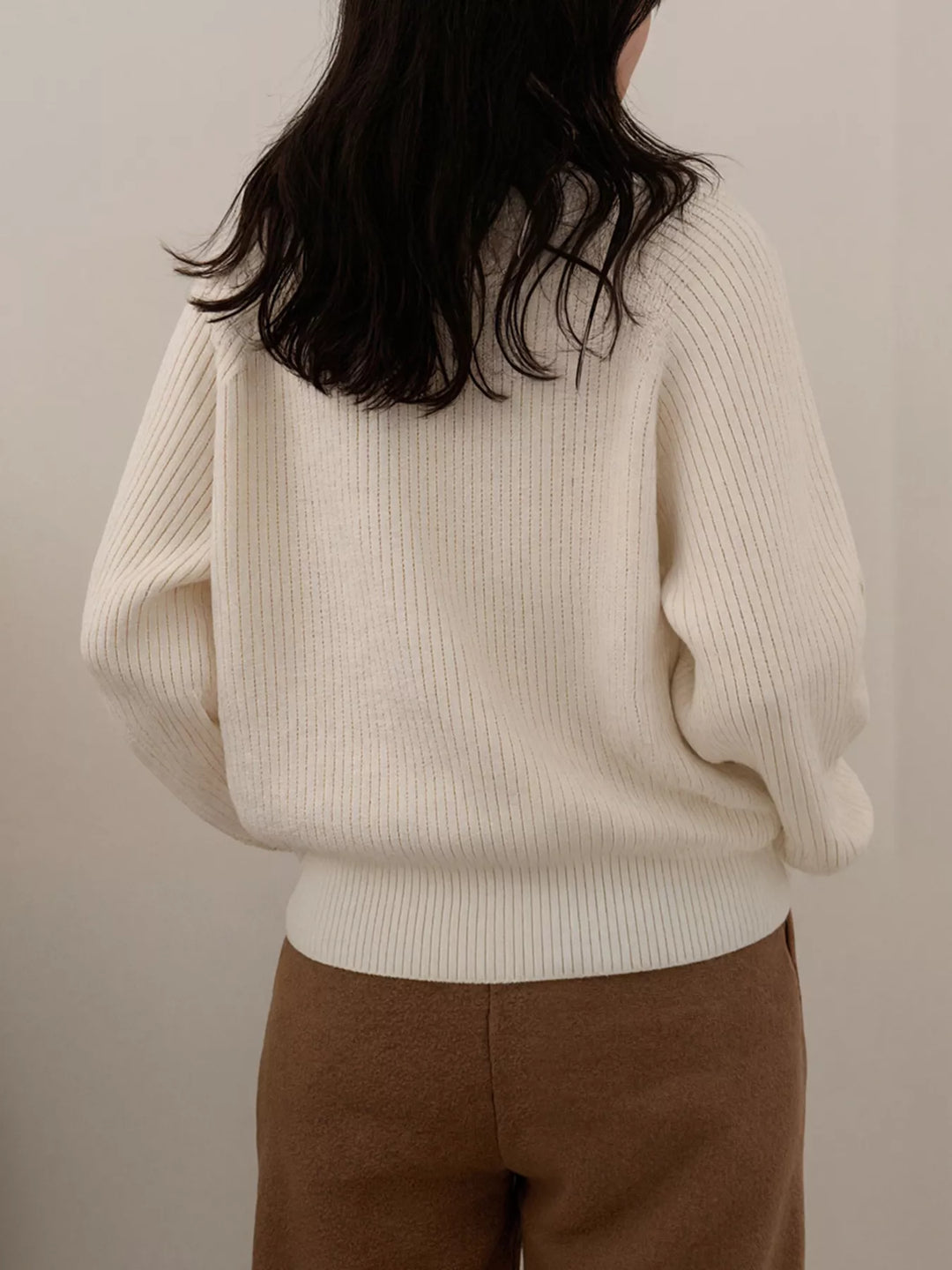 Ribbed knit round neck sweater with shoulder button detail
