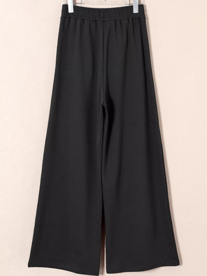 High-rise wide-leg pleated sweatpants with drawstring