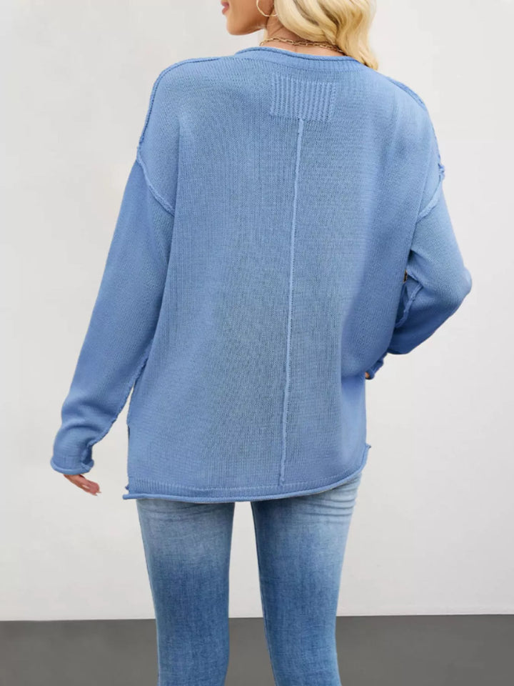 Exposed seam oversized crew neck sweater with raw hem
