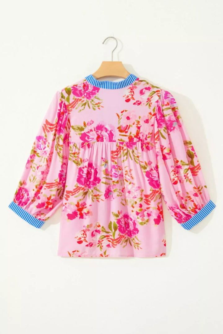 Floral relaxed blouse with striped V-neck and cuff trim