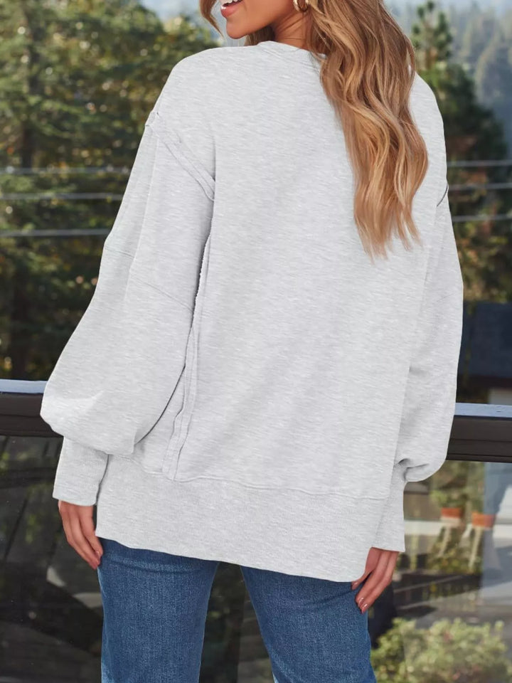 Oversized side-slit sweatshirt with exposed seams