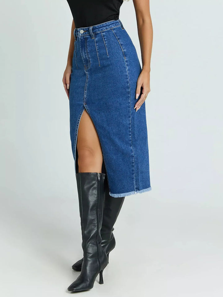 High-waist denim midi skirt with front slit and raw hem