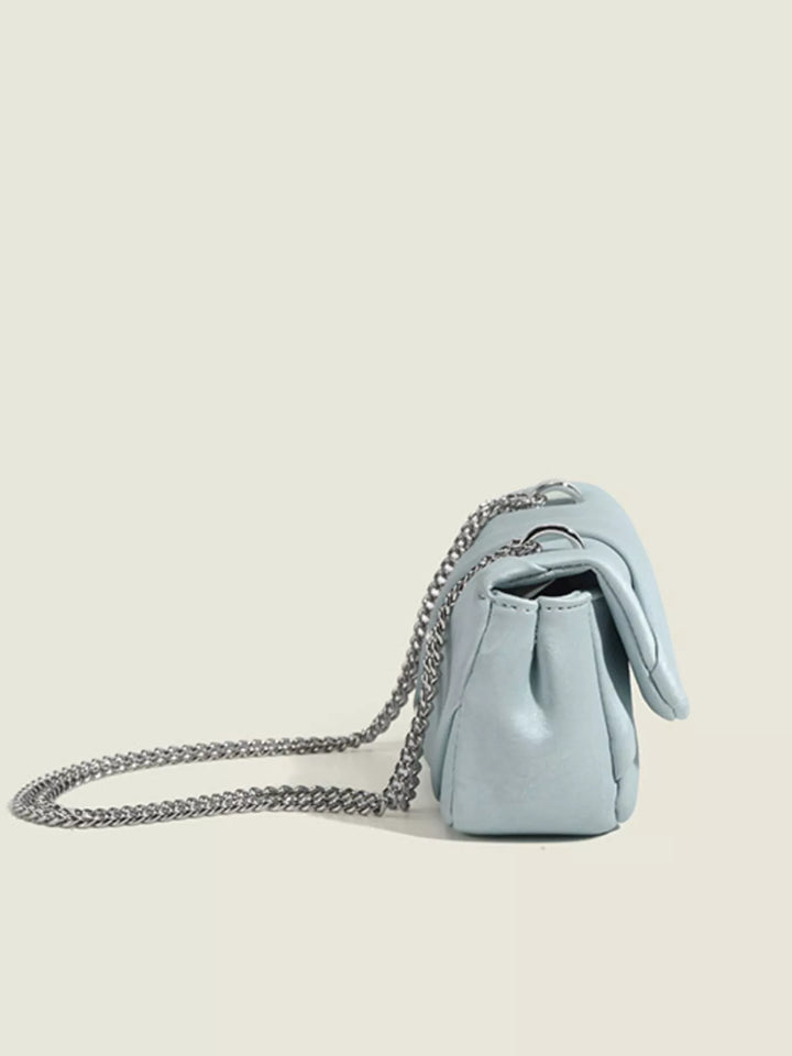 Ruched mini flap crossbody bag with silver chain strap