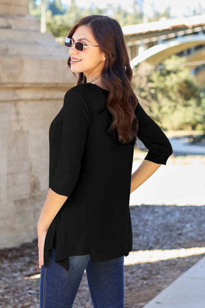Pocketed 3/4 sleeve top with asymmetrical hem