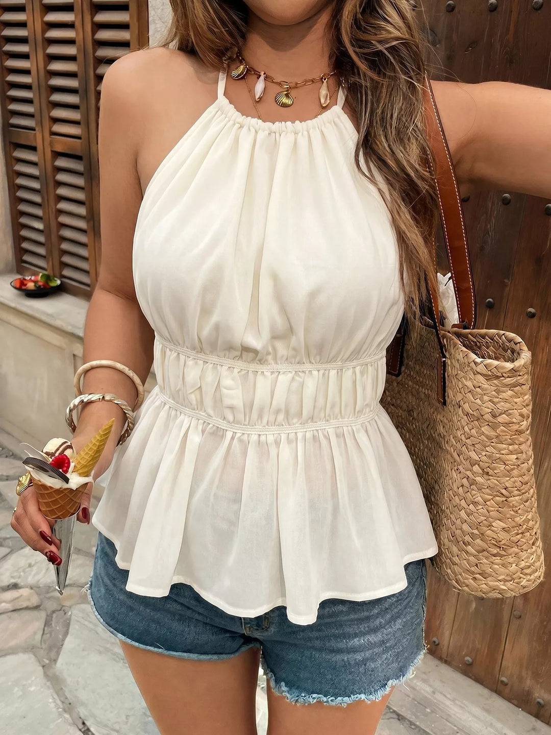 Halter neck peplum top with ruched waist