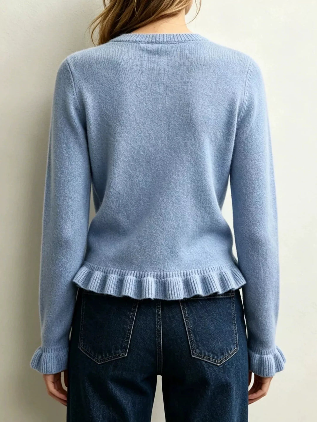 Ruffle hem crew neck knit sweater with ruffled cuffs