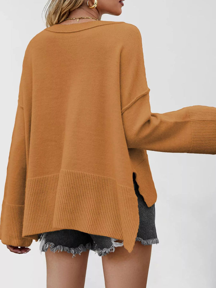 Dropped shoulder flare sleeve sweater with ribbed hem and side slits