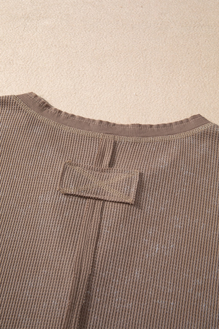 Waffle knit henley top with long sleeves and button placket