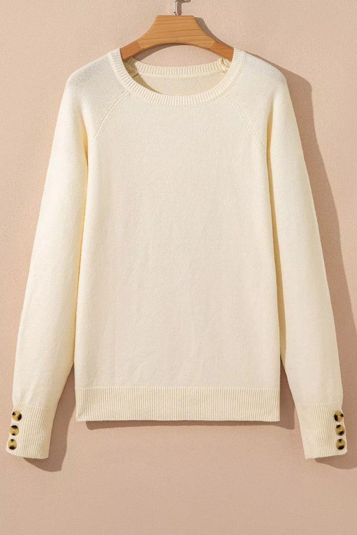 Button-cuff raglan sleeve crew neck sweater