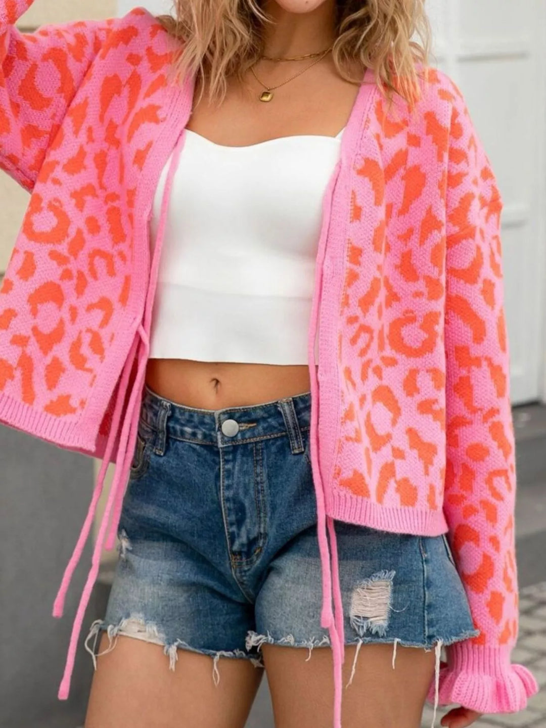 Leopard knit tie-front cardigan with ruffle cuffs