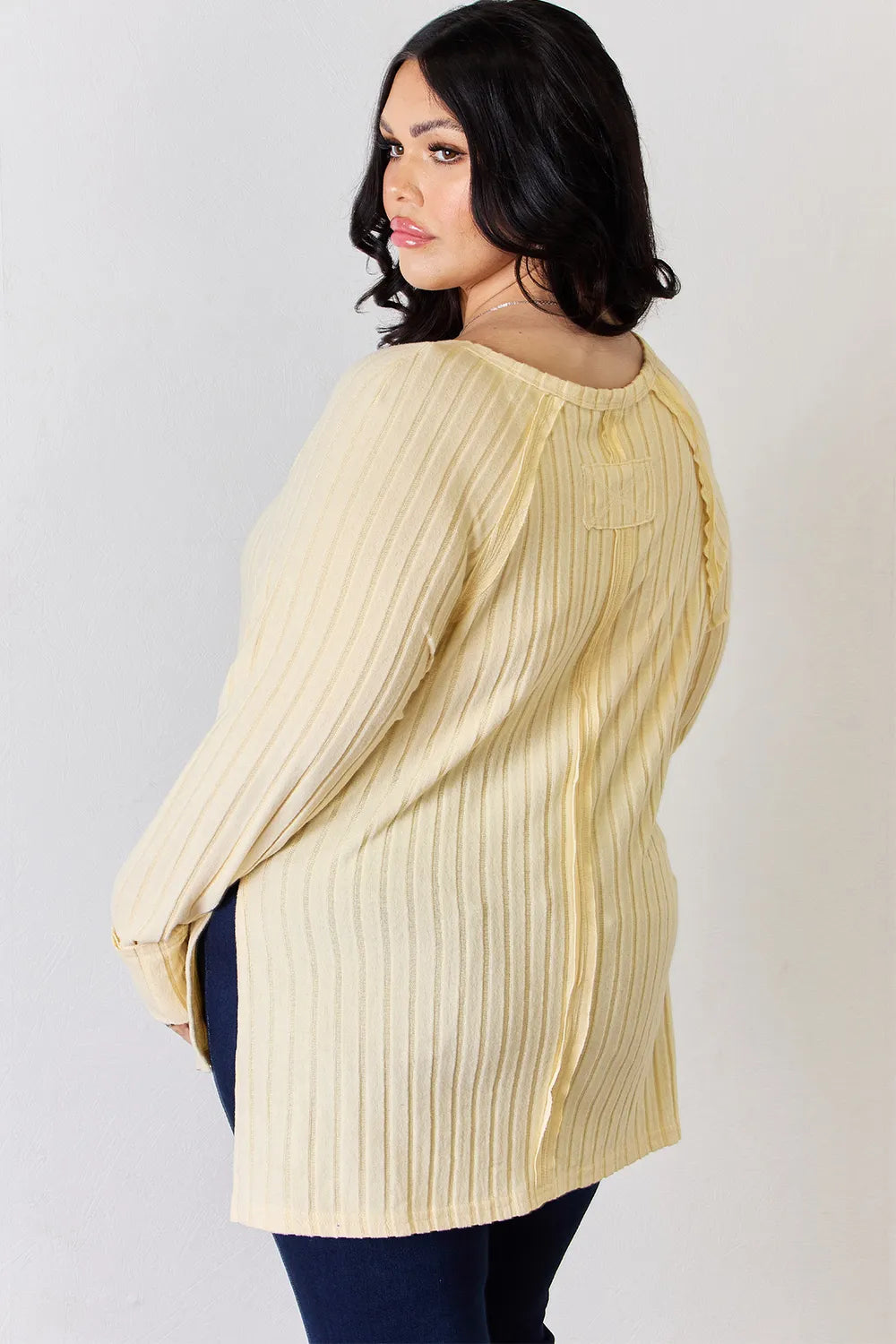 Ribbed knit round neck long sleeve top with side slits