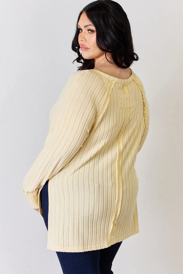 Ribbed knit round neck long sleeve top with side slits