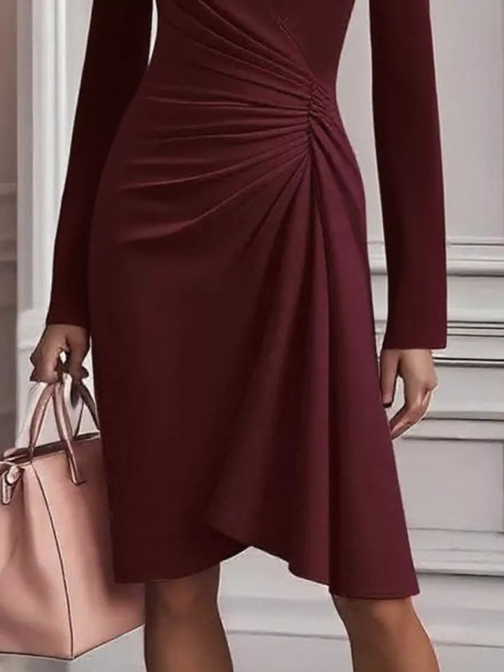 Ruched surplice long sleeve midi dress with asymmetric hem