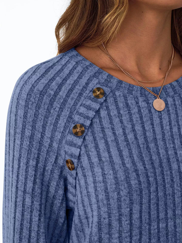 Ribbed knit long sleeve top with decorative shoulder buttons