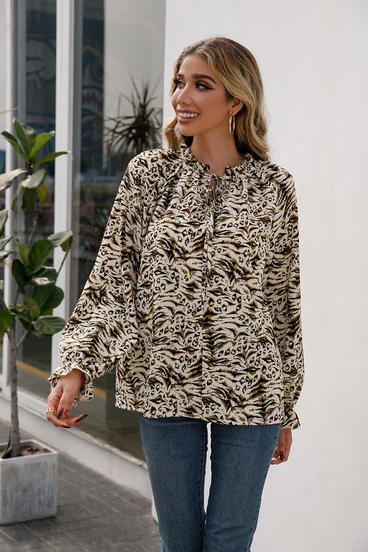 Animal print tie-neck blouse with flounce sleeves