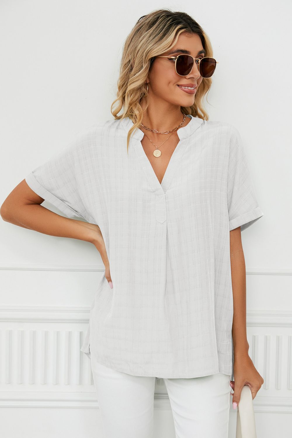 Notched neck cuffed short sleeve blouse with side slits