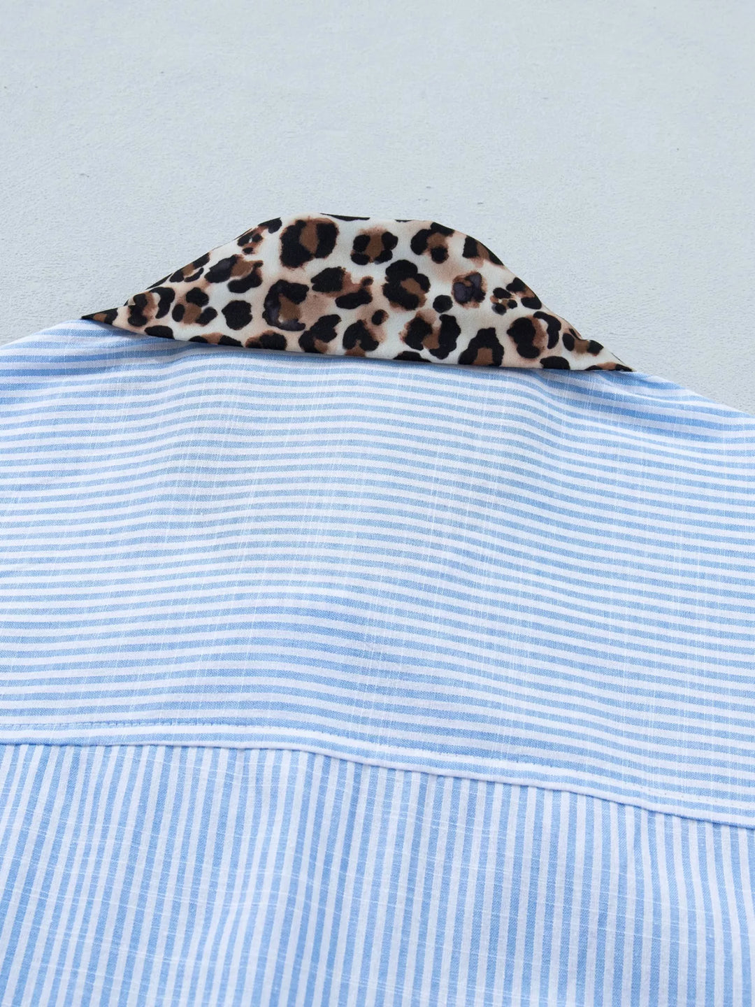 Striped short-sleeve button-down with leopard collar and cuffs