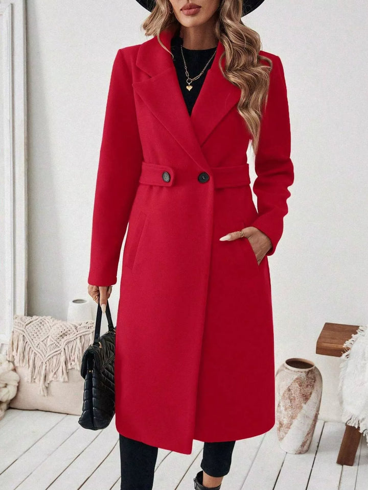 Longline notch lapel coat with single-button waist tab